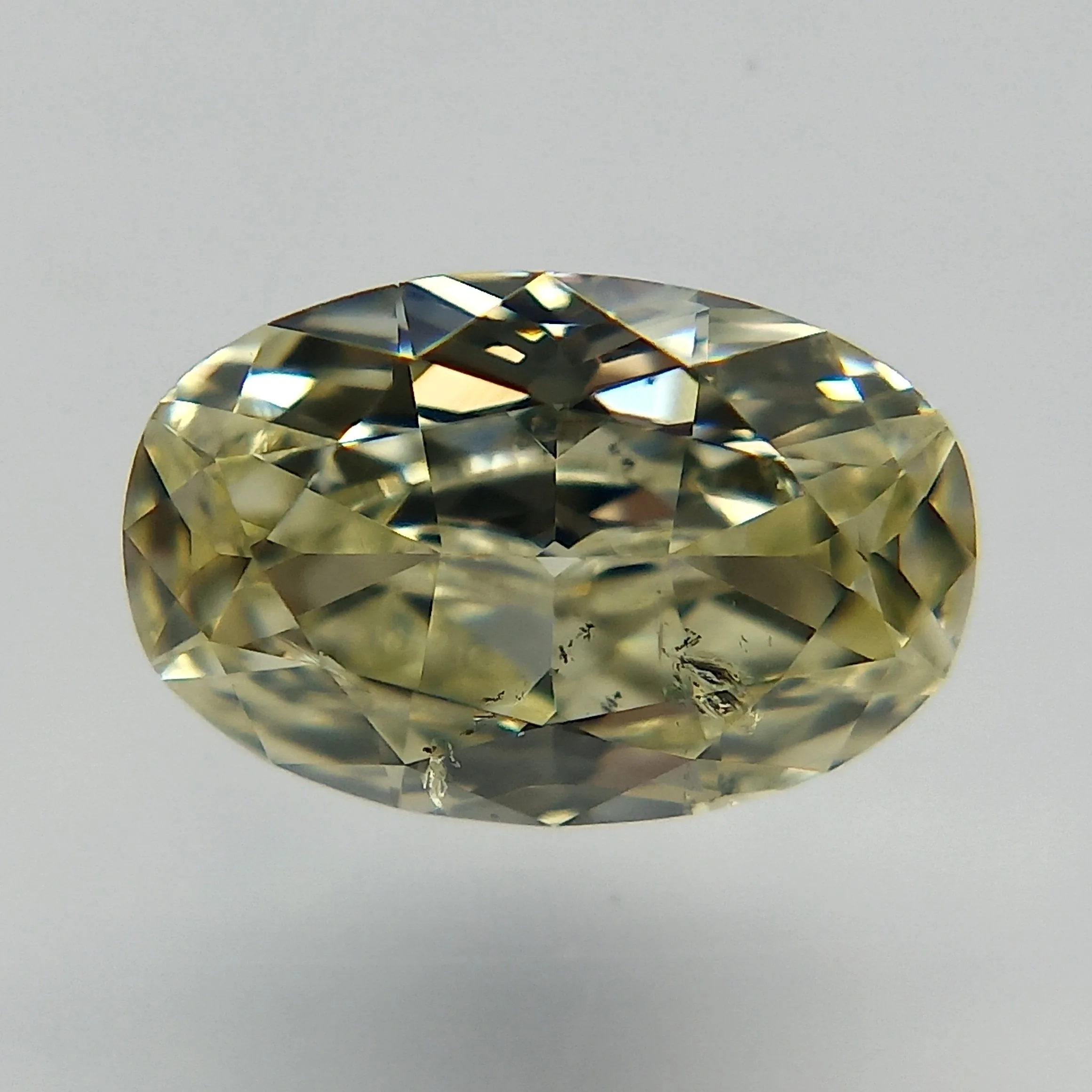 0.55 Carat Oval Fancy Light Yellow I1 Natural Diamond