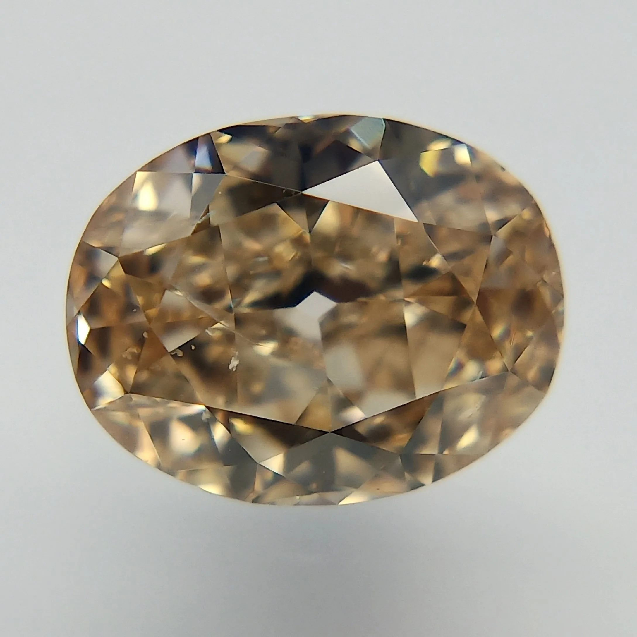 0.72 Carat Oval Fancy Orange Brown SI2 Natural Diamond