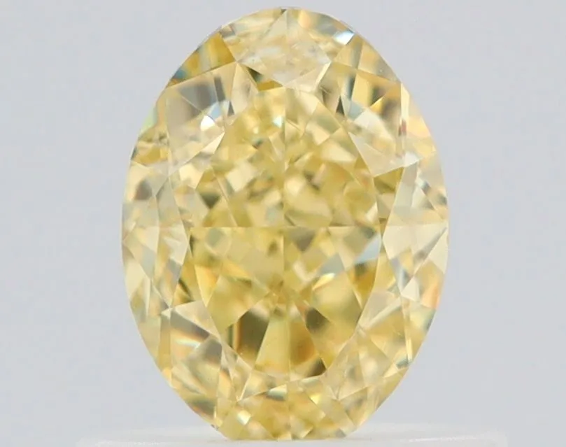 0.7 Carat Oval Fancy Yellow VVS1 Natural Diamond 1 0.7 Carat Oval Fancy Yellow VVS1 Natural Diamond