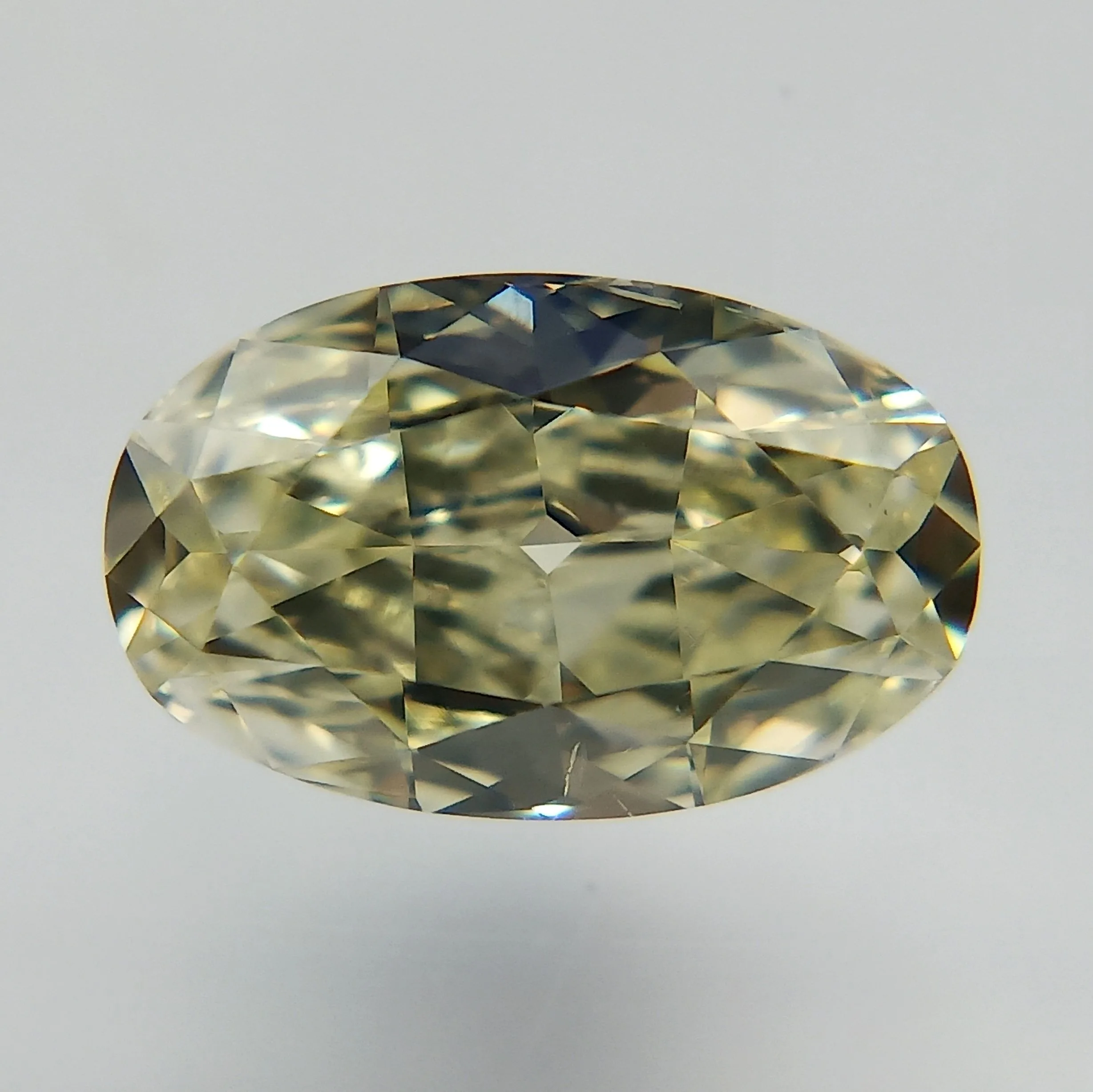 0.61 Carat Oval Fancy Light Yellow SI1 Natural Diamond