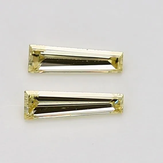 0.17 Carat Tapered Baguette Fancy Yellow VVS2 Natural Diamond