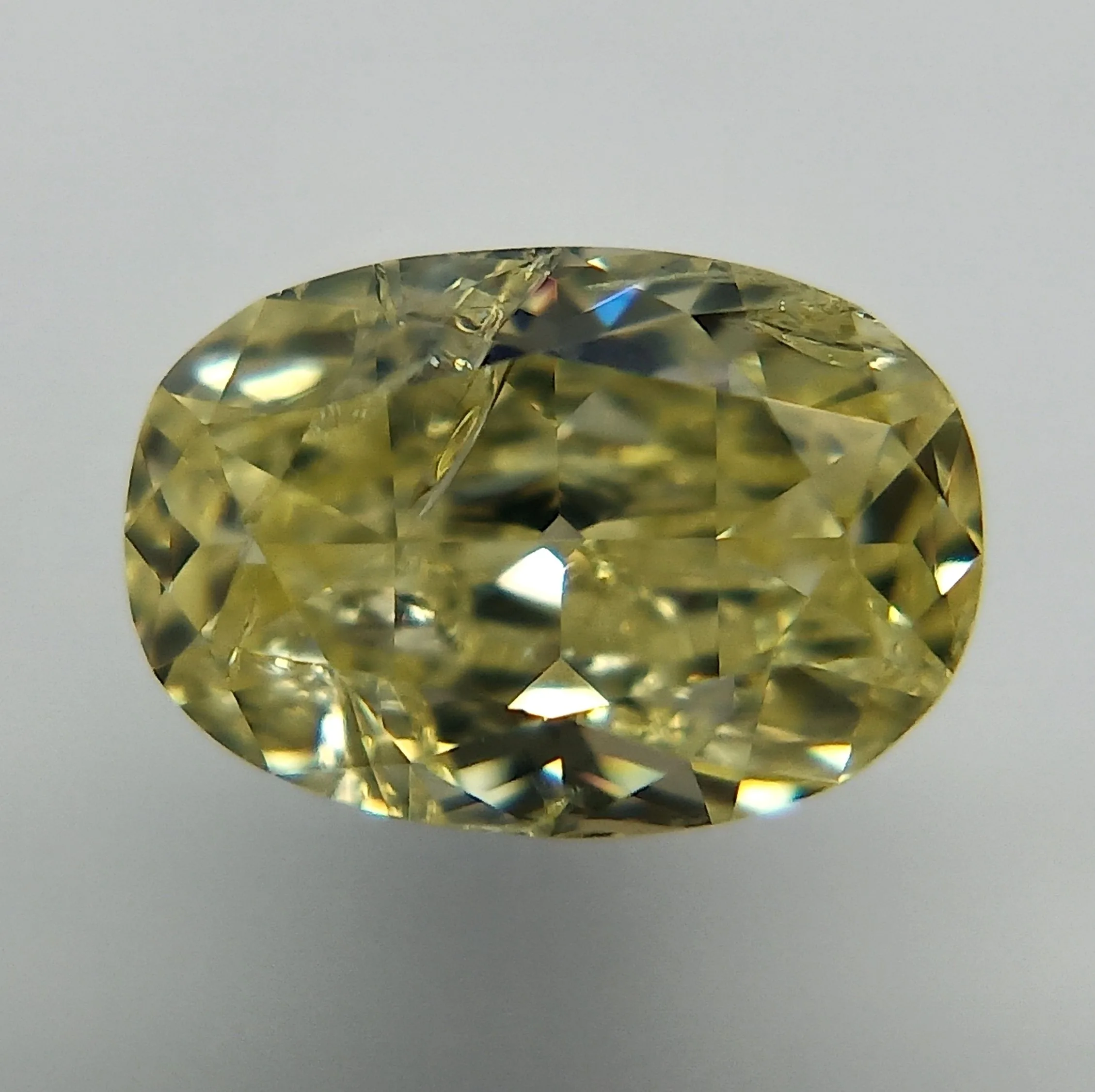0.31 Carat Oval Fancy Yellow Natural Diamond
