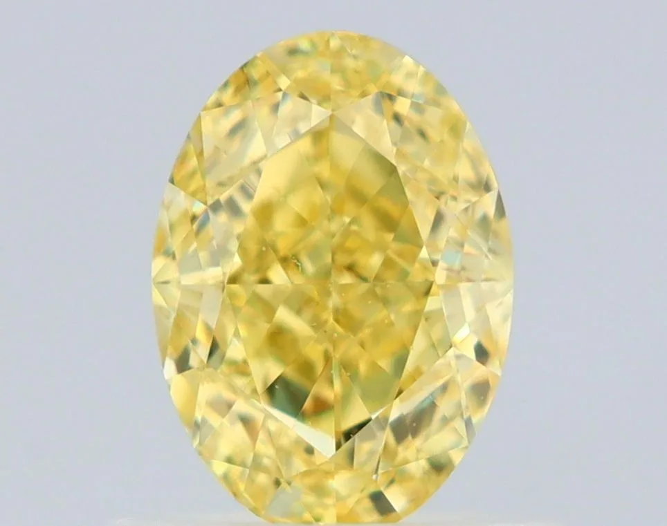 0.75 Carat Oval Fancy Intense Yellow VS2 Natural Diamond 1 0.75 Carat Oval Fancy Intense Yellow VS2 Natural Diamond
