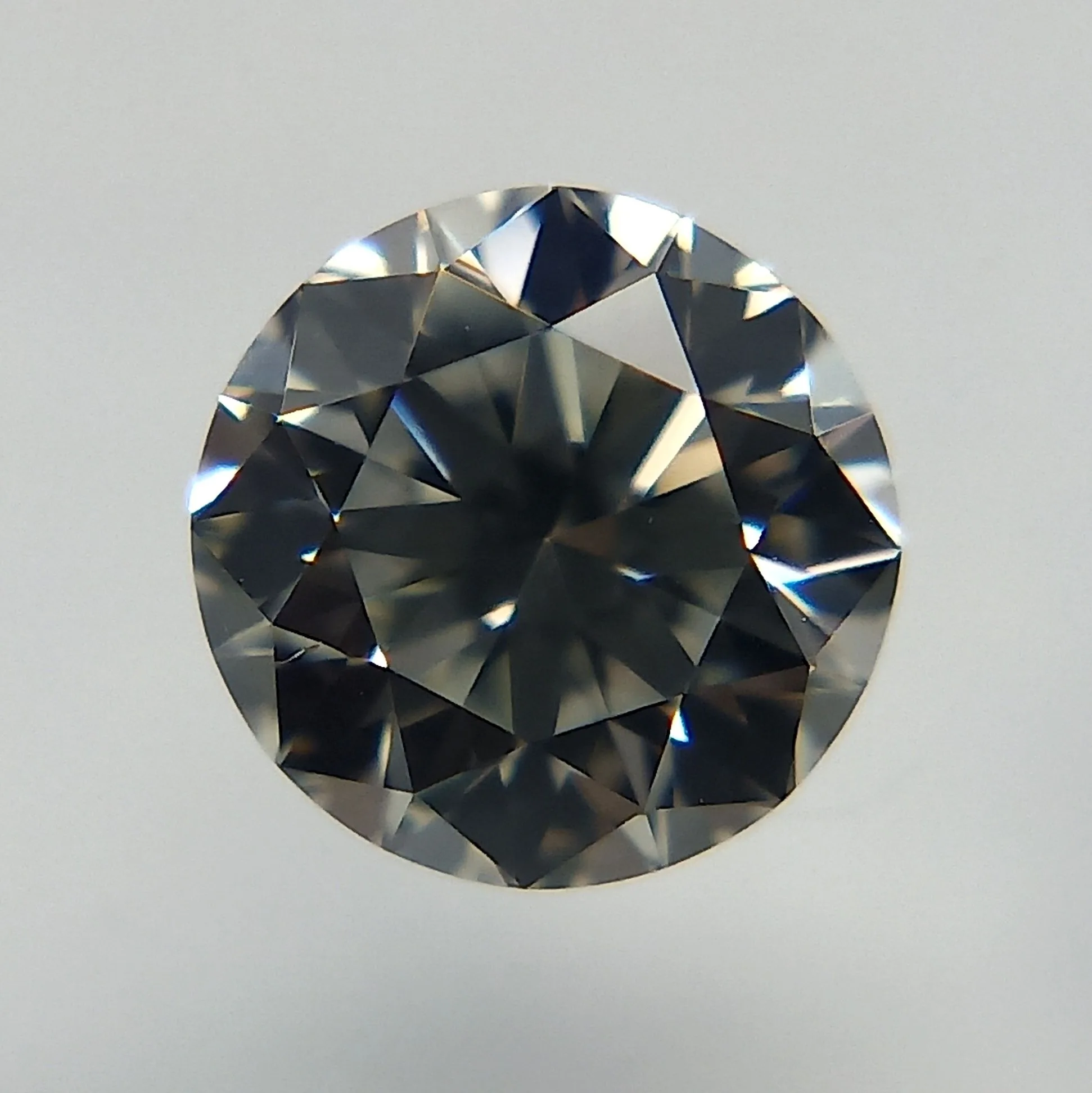 0.4 Carat Round Faint Gray VS1 Natural Diamond