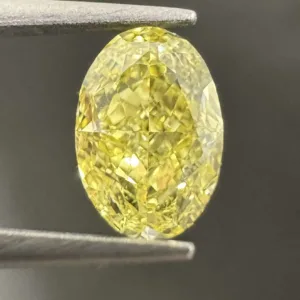 0.61 Carat Oval Fancy Intense Yellow VVS2 Natural Diamond
