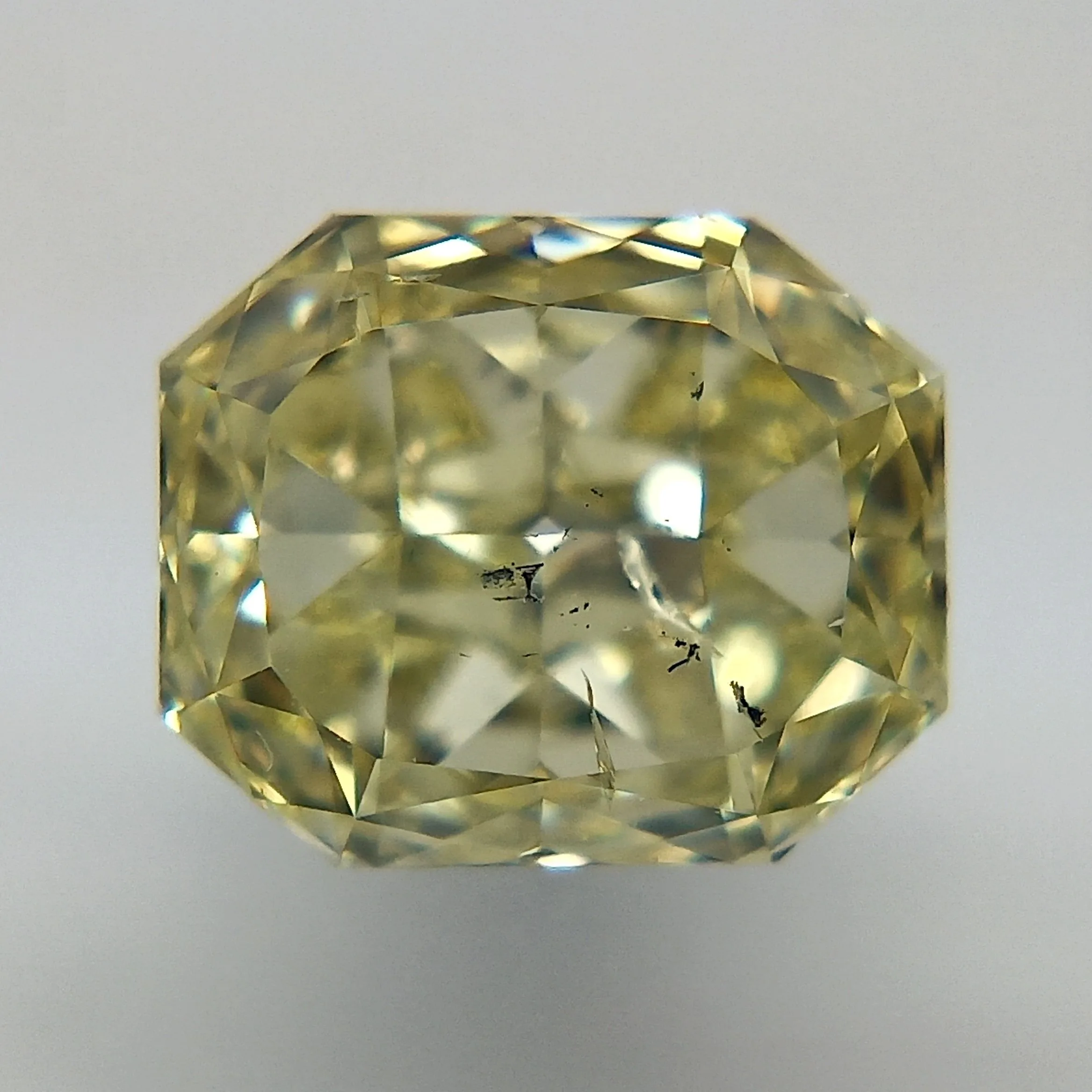 0.71 Carat Radiant Fancy Yellow Natural Diamond