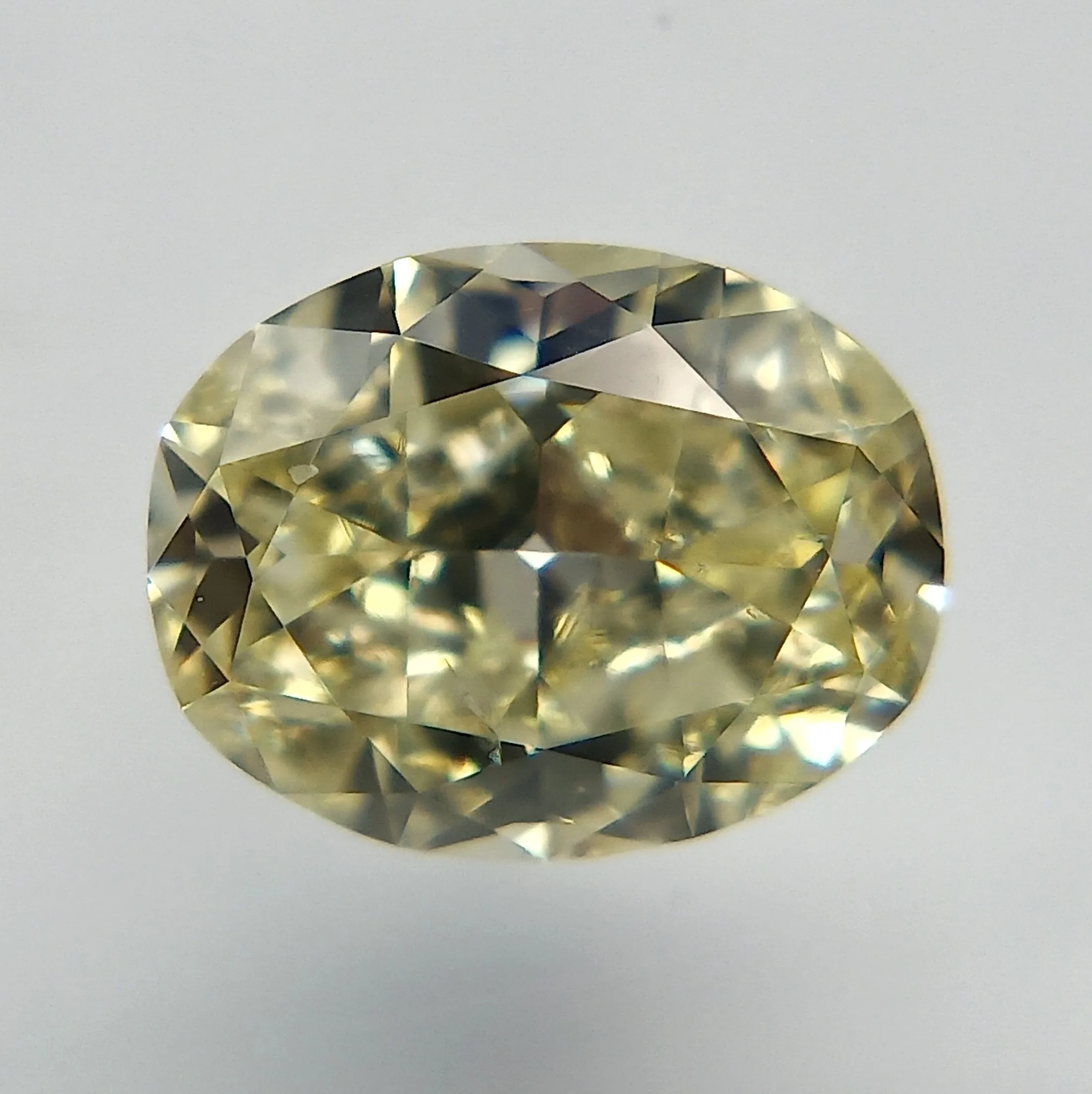 0.54 Carat Oval Fancy Light Yellow SI1 Natural Diamond