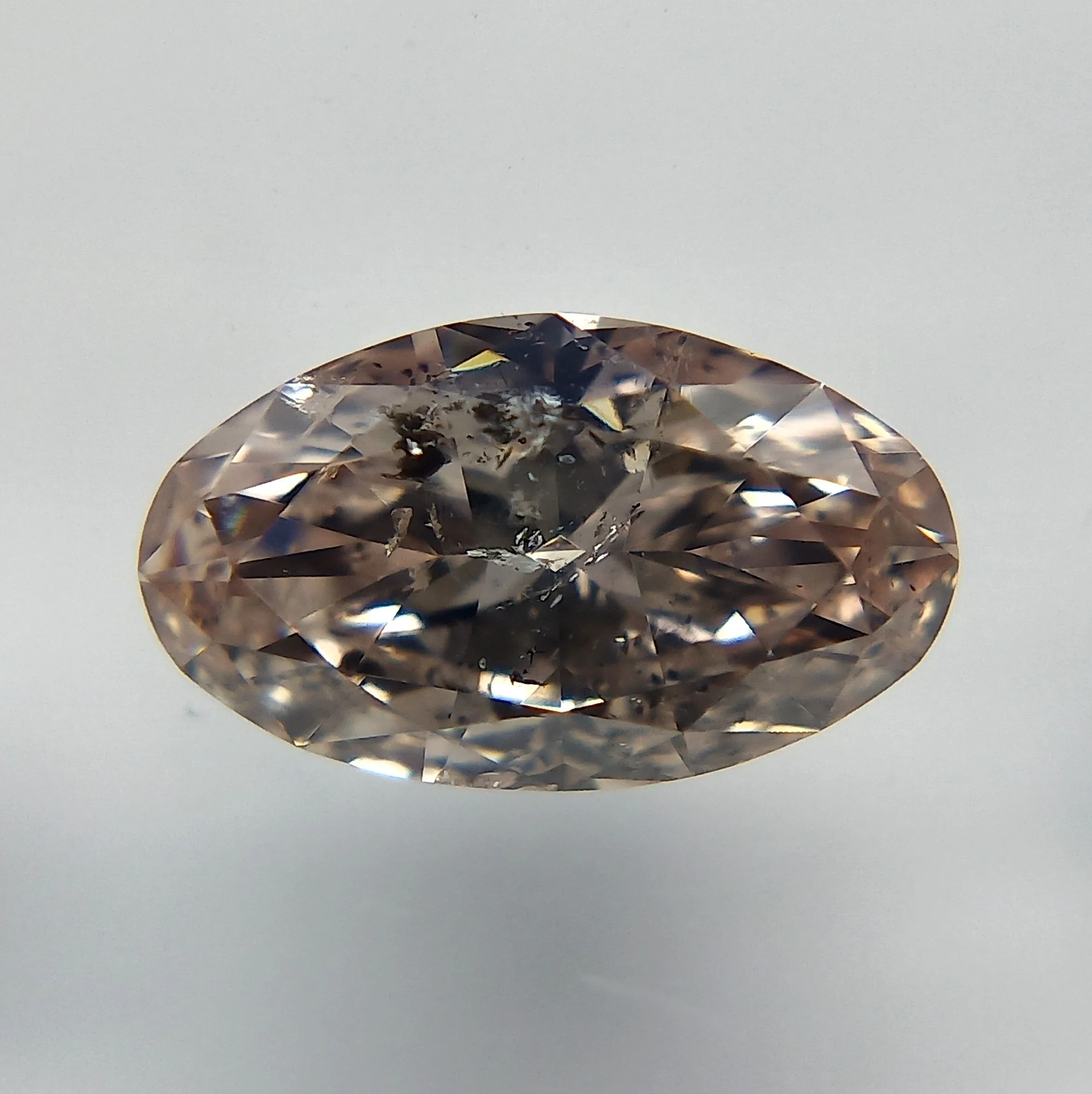 0.61 Carat Oval Fancy Pink Natural Diamond