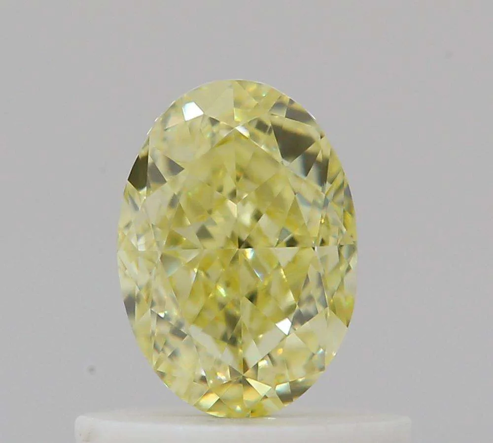 0.66 Carat Oval Fancy Yellow VVS2 Natural Diamond 1 0.66 Carat Oval Fancy Yellow VVS2 Natural Diamond