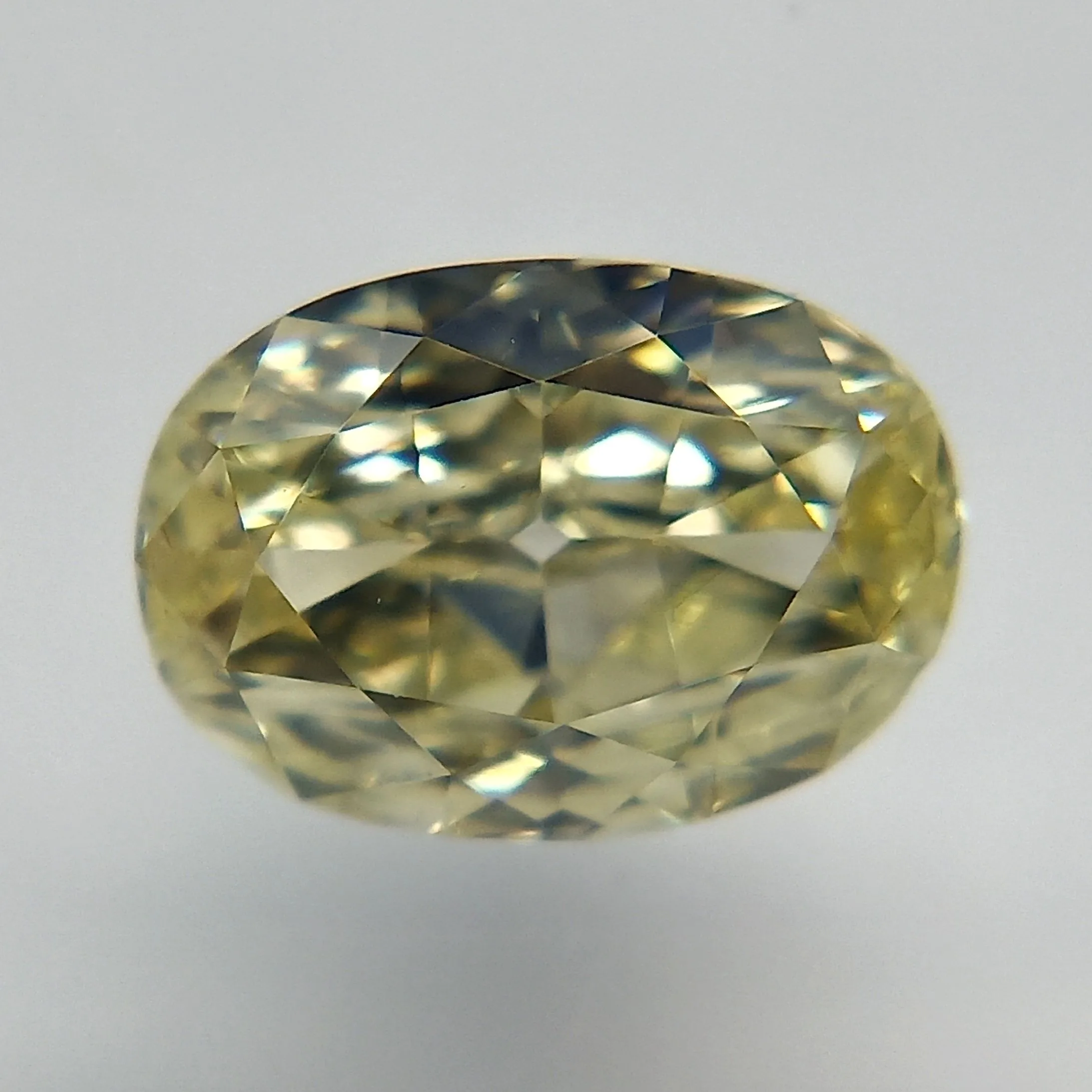 0.52 Carat Oval Fancy Light Yellow VS1 Natural Diamond