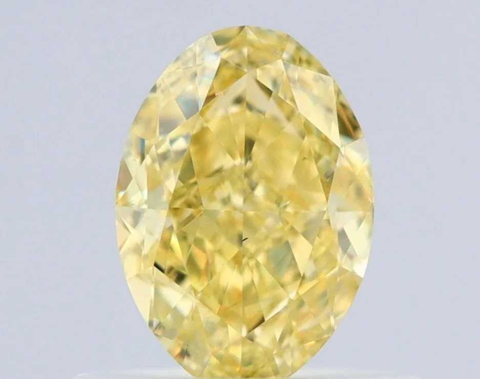 0.63 Carat Oval Fancy Intense Yellow VS2 Natural Diamond 1 0.63 Carat Oval Fancy Intense Yellow VS2 Natural Diamond