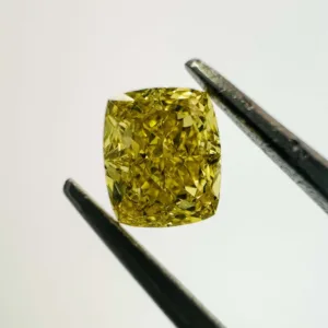 0.6 Carat Cushion Brilliant Fancy Vivid Yellow VS2 Natural Diamond