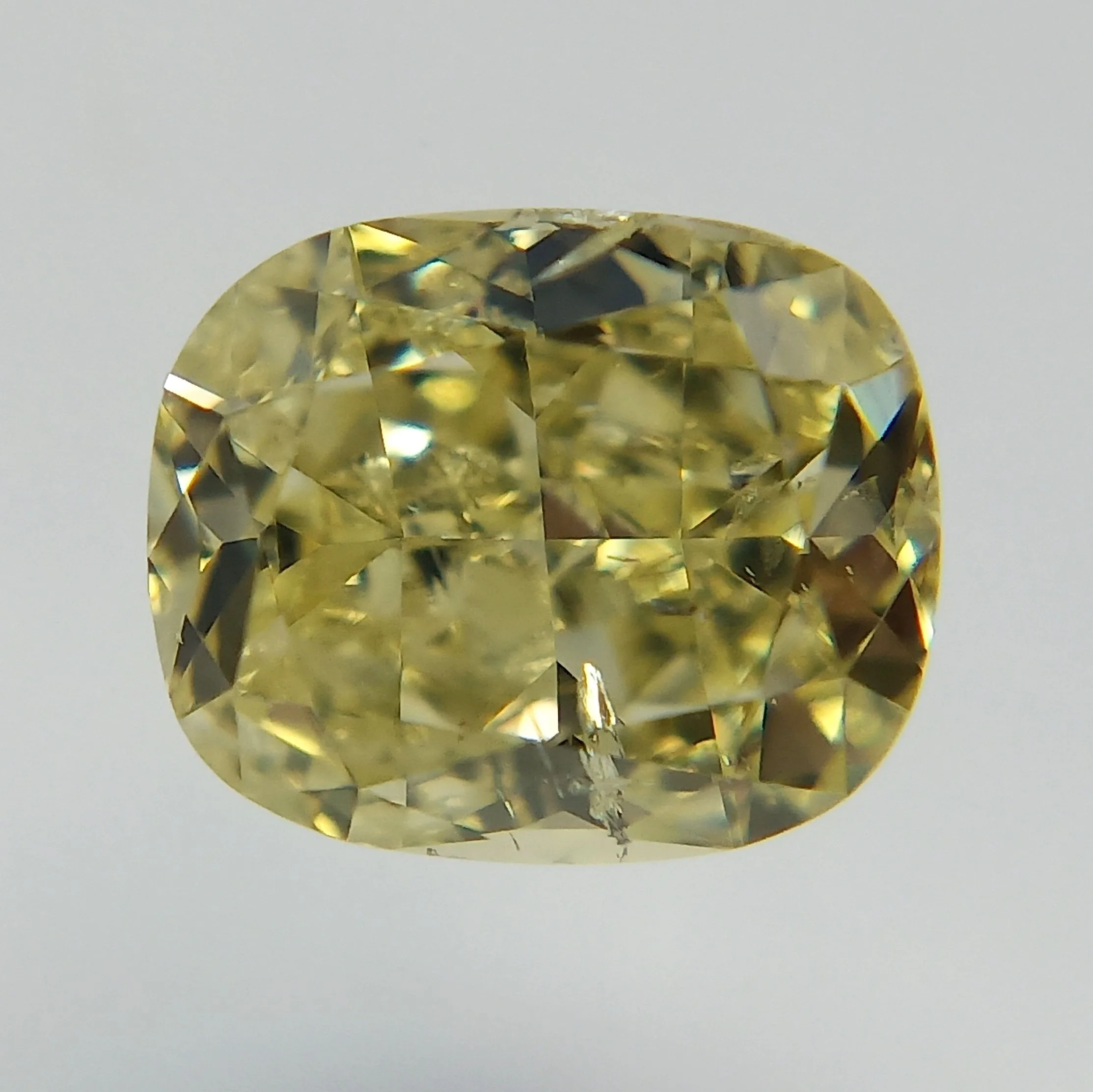 0.71 Carat Cushion Modified Fancy Yellow Natural Diamond