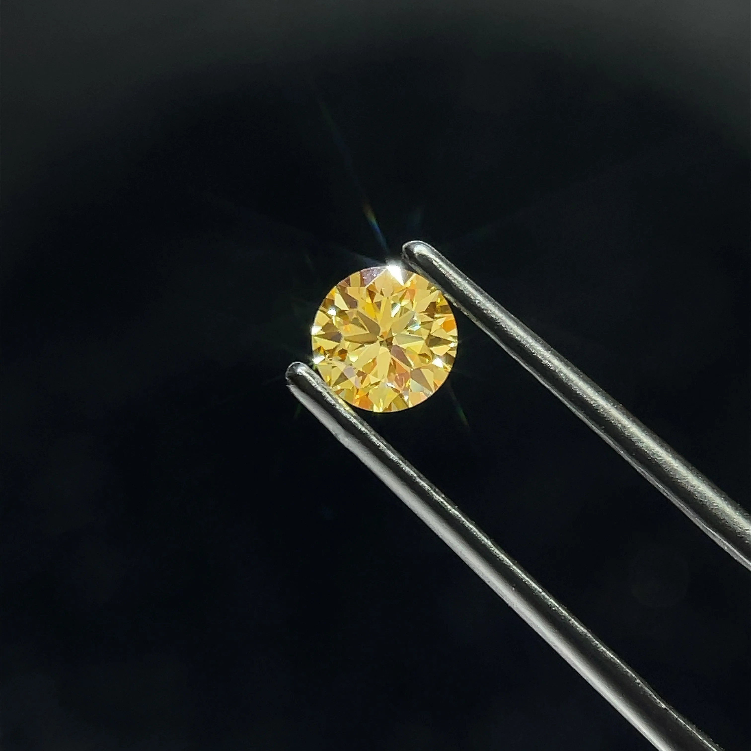 0.69 Carat Round Fancy Intense Yellow VVS2 Lab Diamond 1 0.69 Carat Round Fancy Intense Yellow VVS2 Lab Diamond